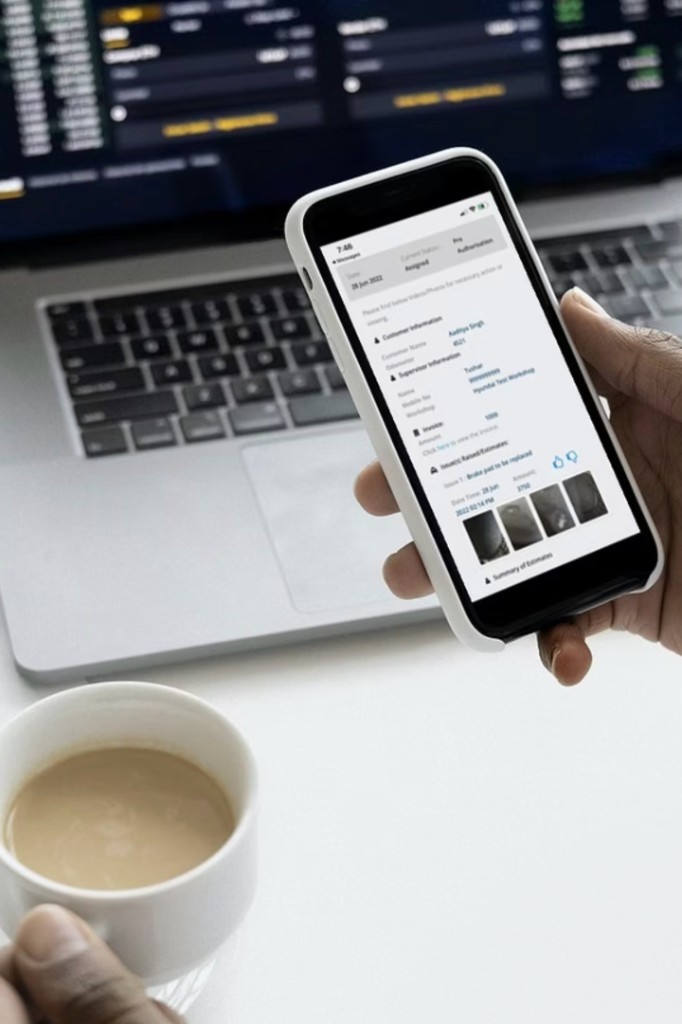 Customer reviewing repair estimate and pre-authorisation on mobile